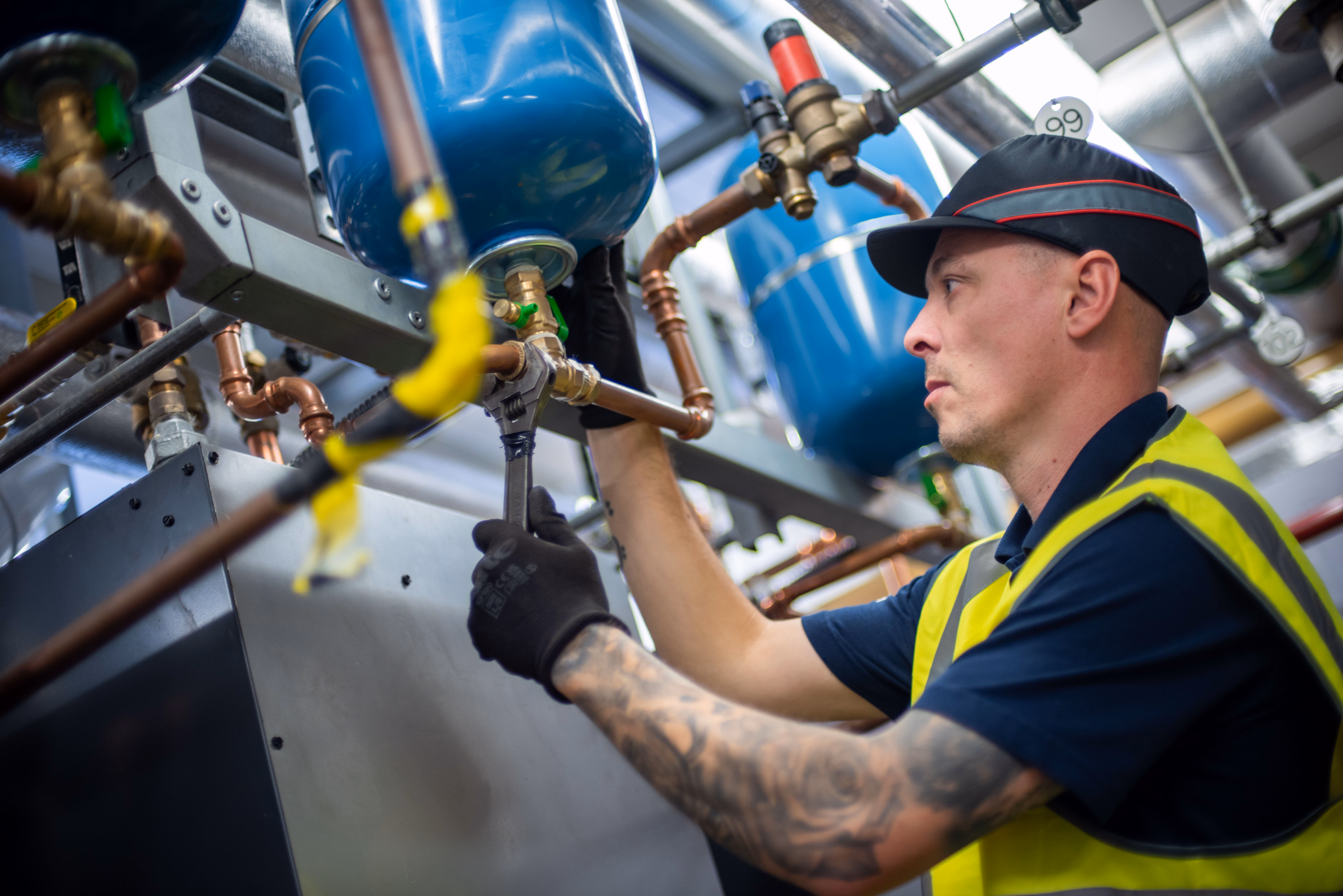 EMTEC team member working on a pipe