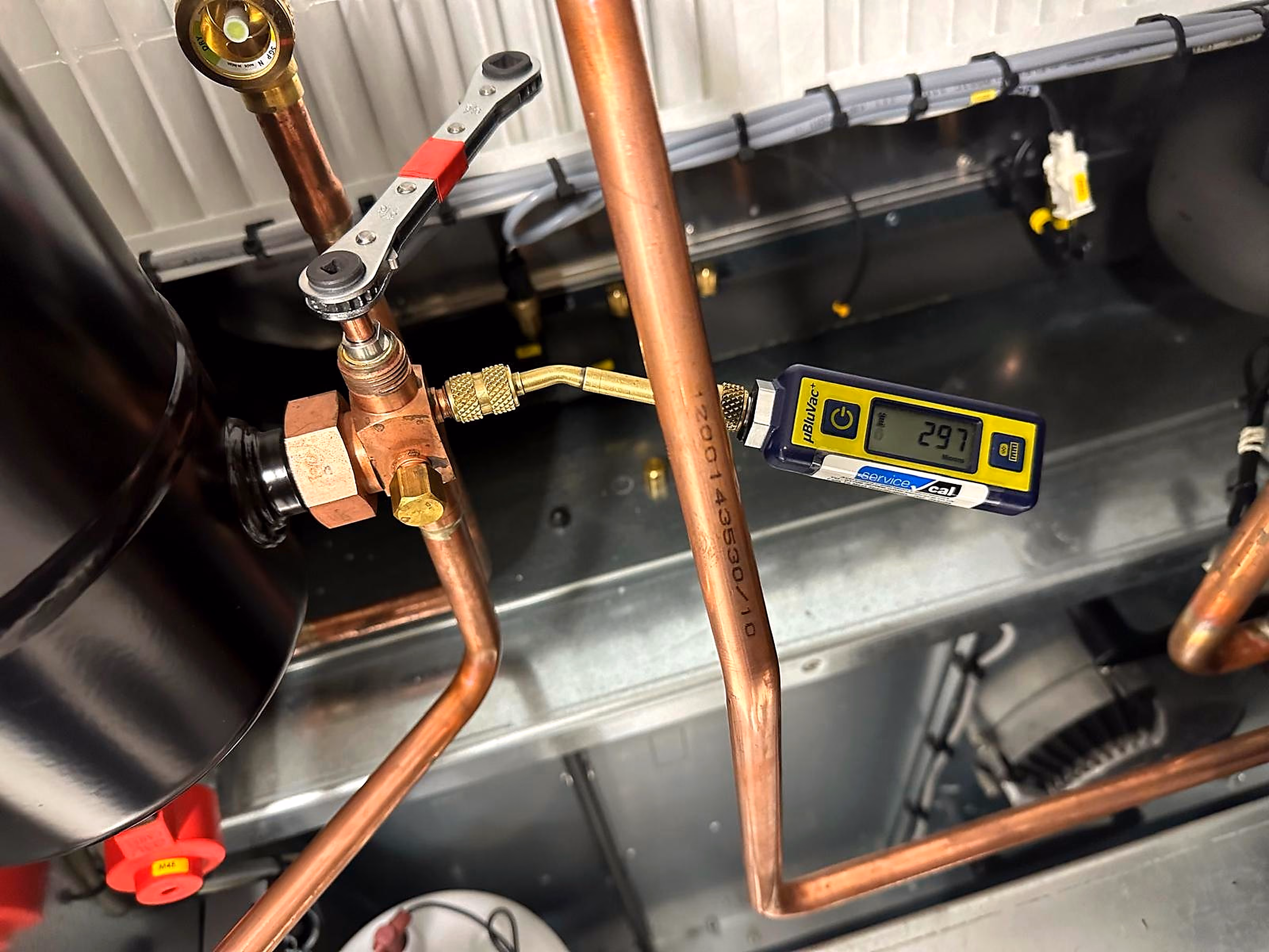 Vacuum and pressure testing of the new refrigerant systems