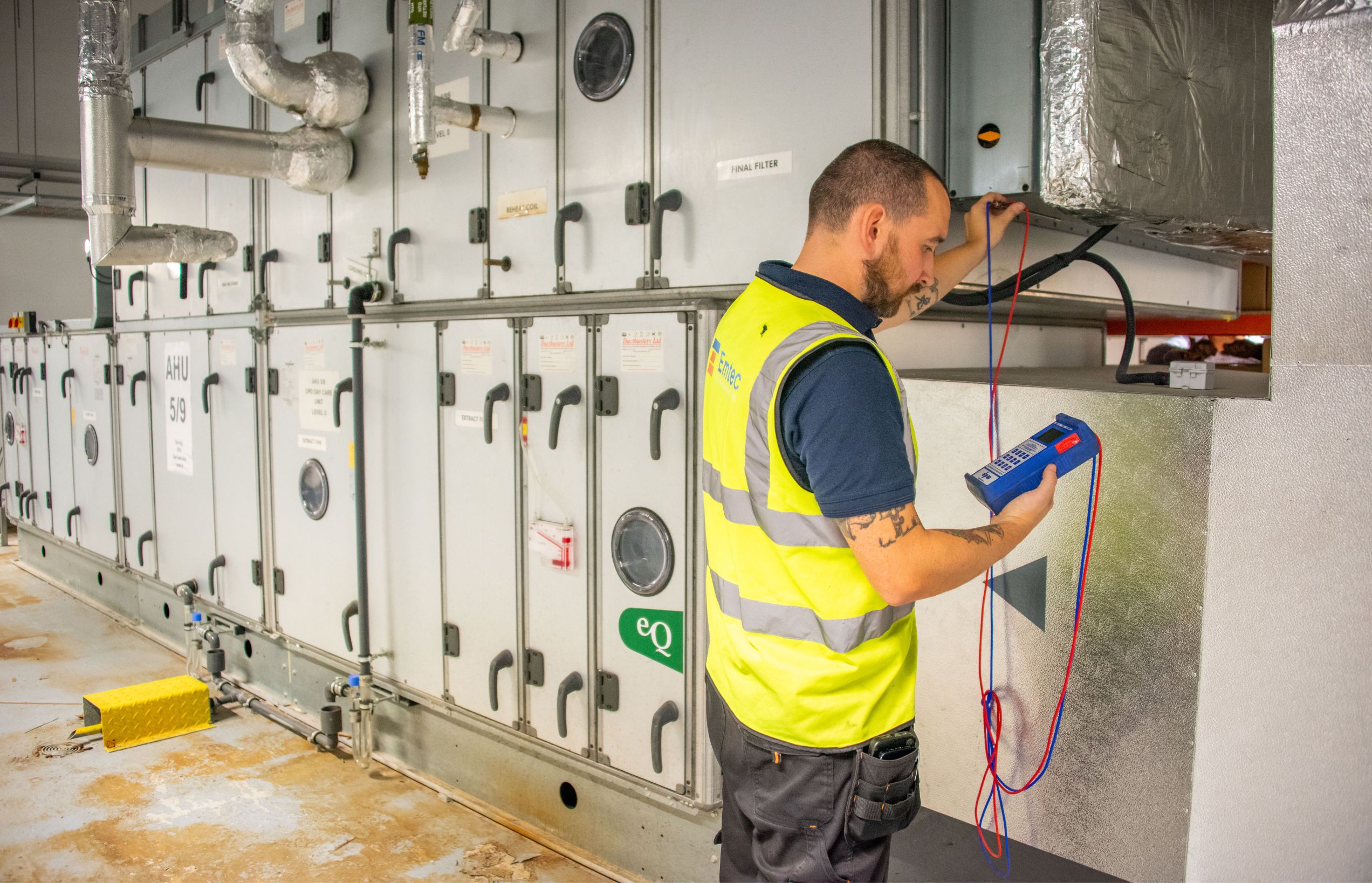 Emtec engineer carrying out planned maintenance in a school plant room