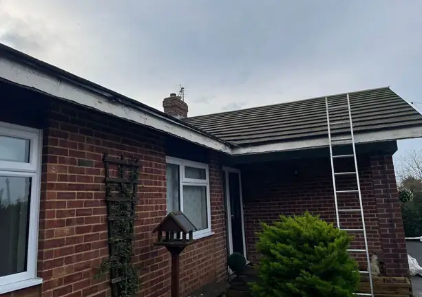 Roof edge insulation board installation on residential home