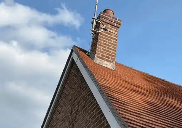Chimney flashing and pointing repair on pitched roof