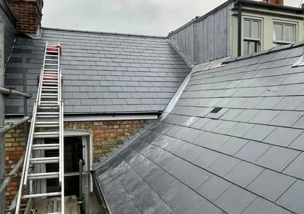 Slate roof inspection and repair work on pitched roof