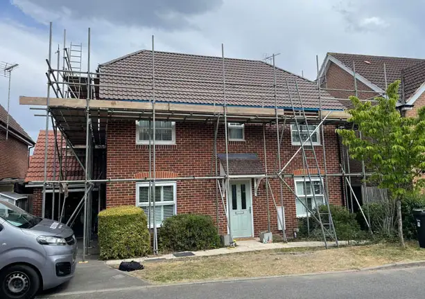 Emergency roof repair in progress on residential property