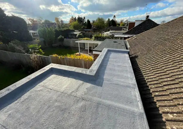 Flat roof installation with clean waterproof finish on modern home