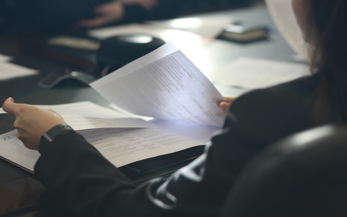 Procurement documents and notes on a desk