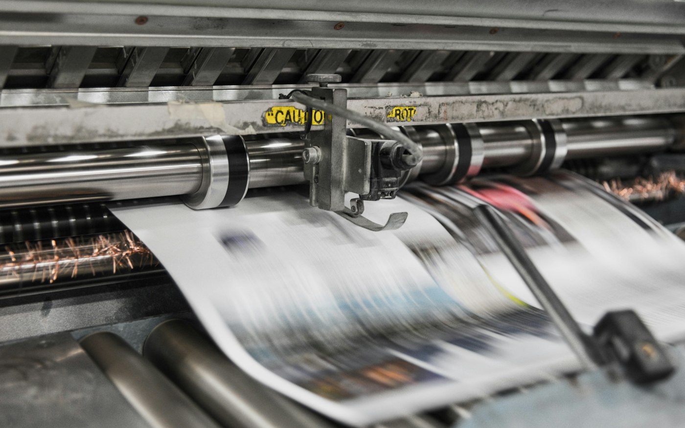 Printing press running a print job