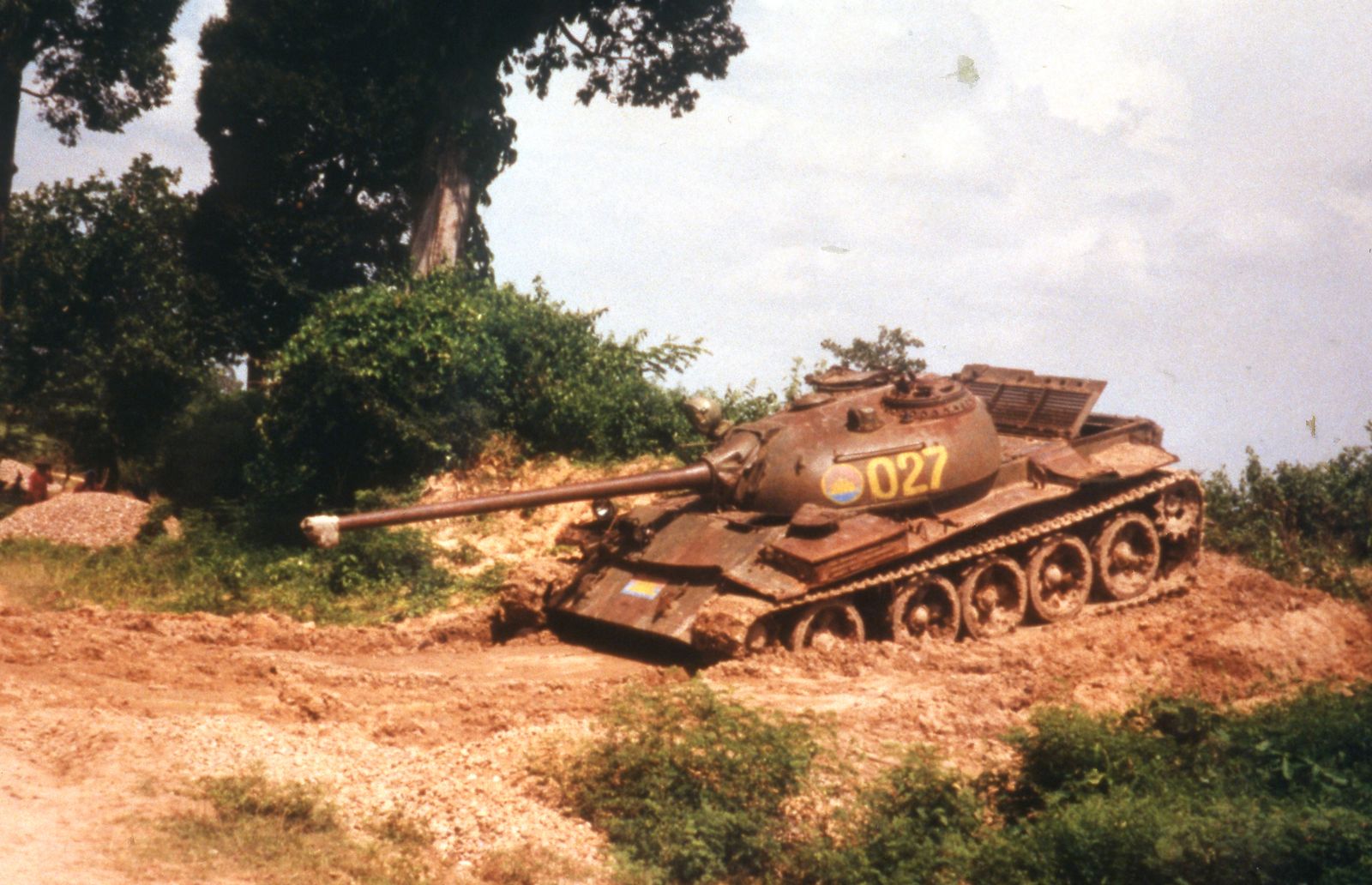 An abandoned tank on the roadside