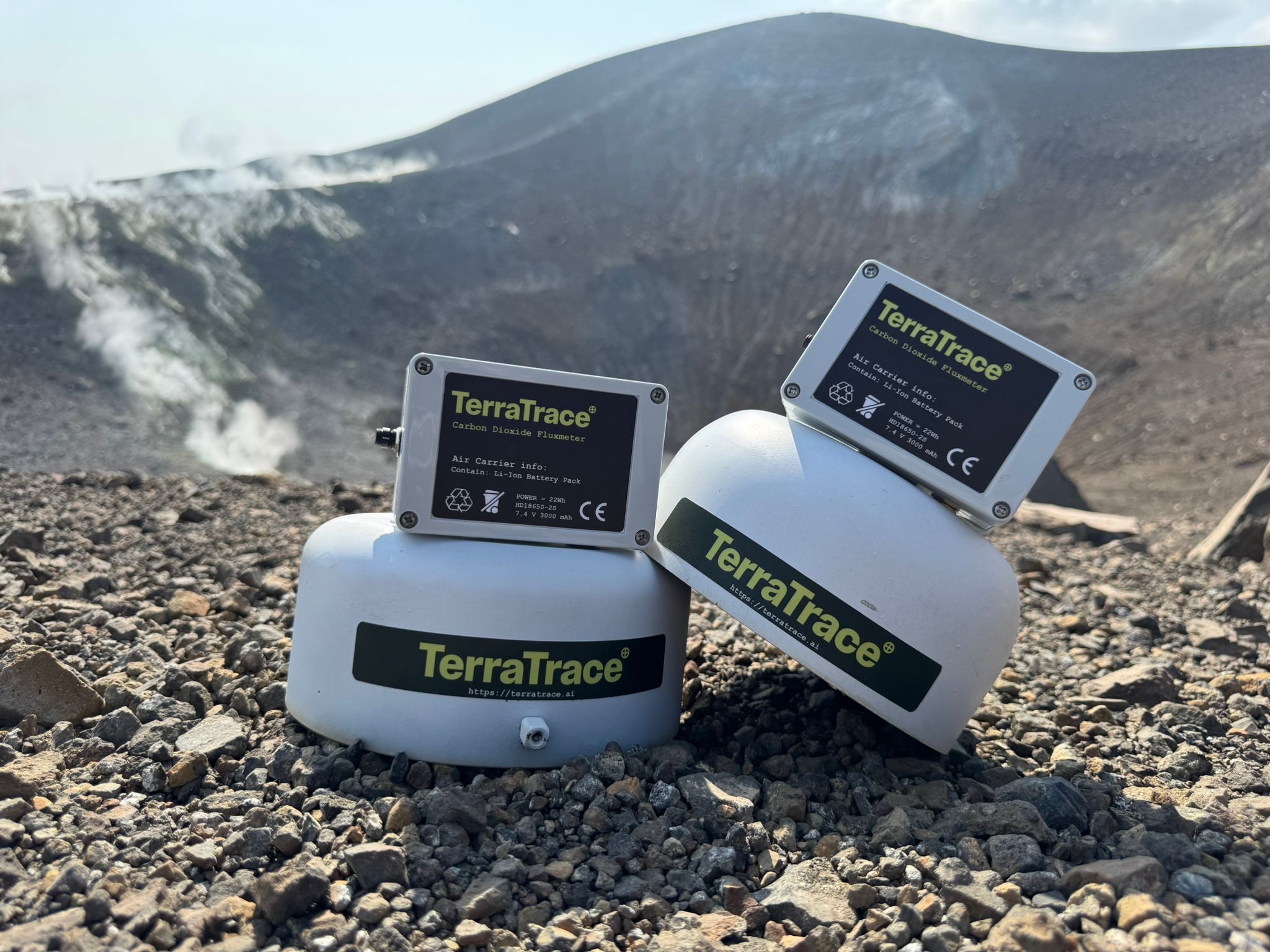 Two TerraTrace fluxmeters standing on gravel at a survey site