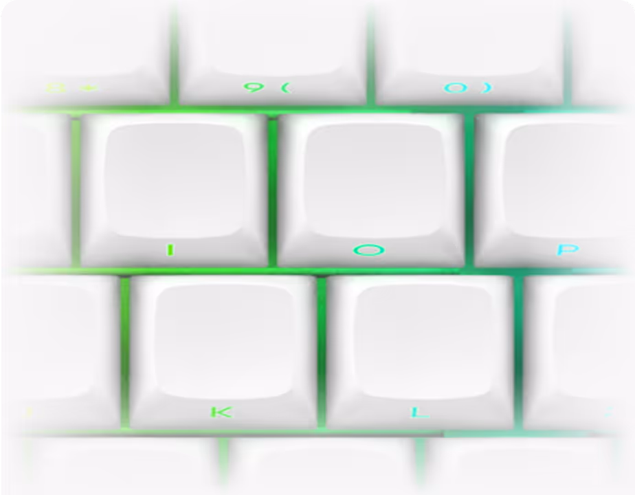 Close-up of white keyboard keys I, O, P, K, and L with green backlighting.