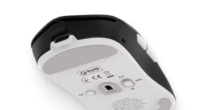 Bottom view of a black and white wireless computer mouse showing certification marks and a power switch.