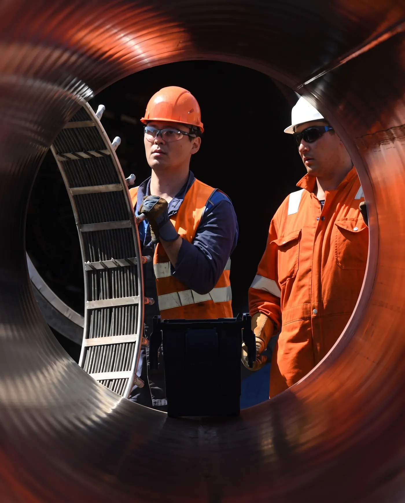 Technician servicing a pump installation
