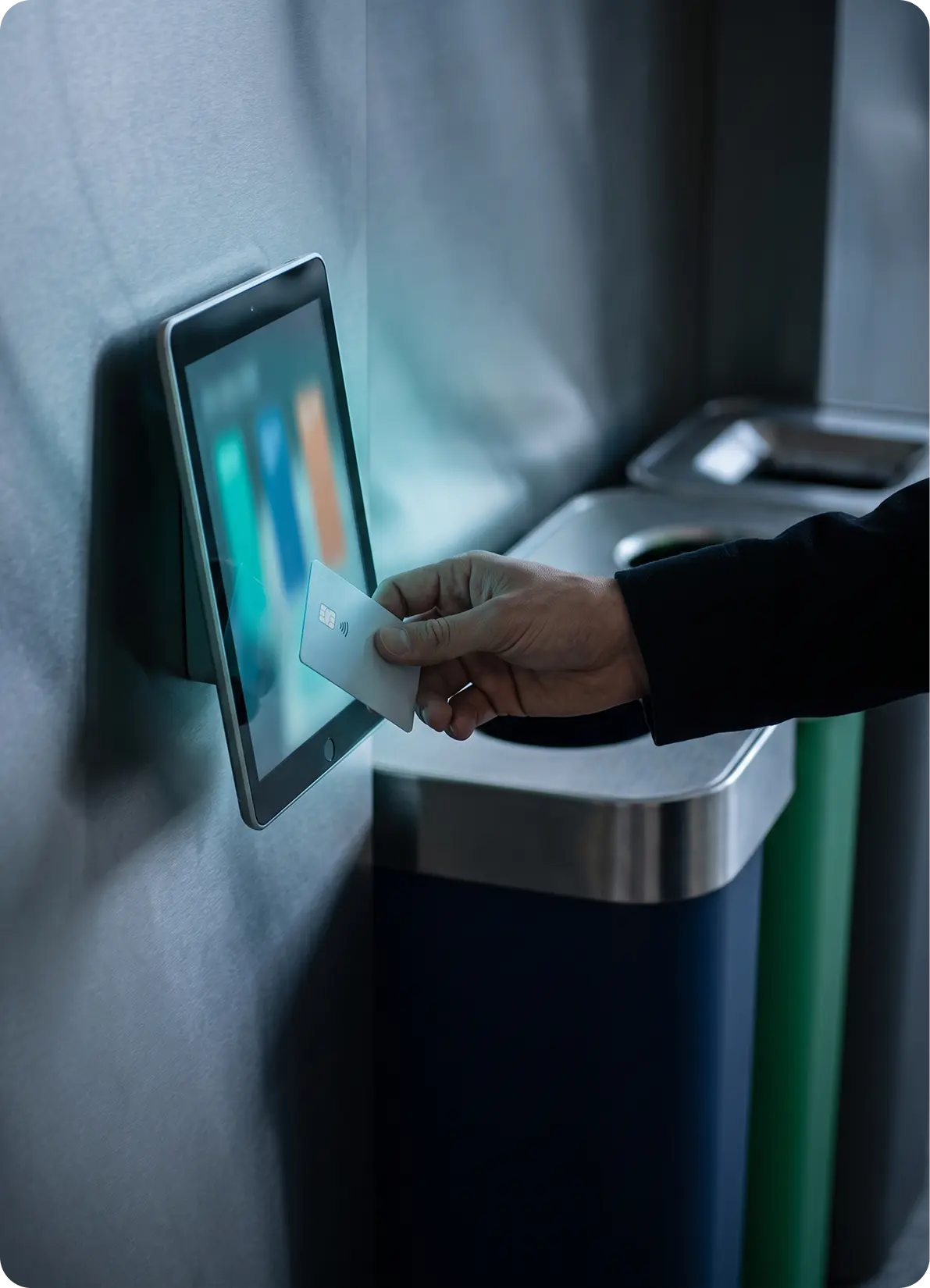 Tenant tapping a card at the garbage-room tablet