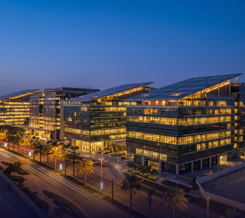 Office buildings with rooftop solar at dusk