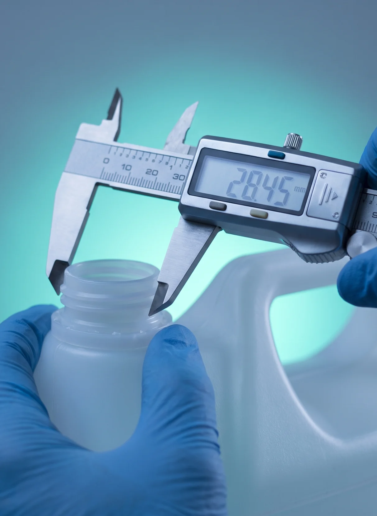 Calipers measuring the neck of a container