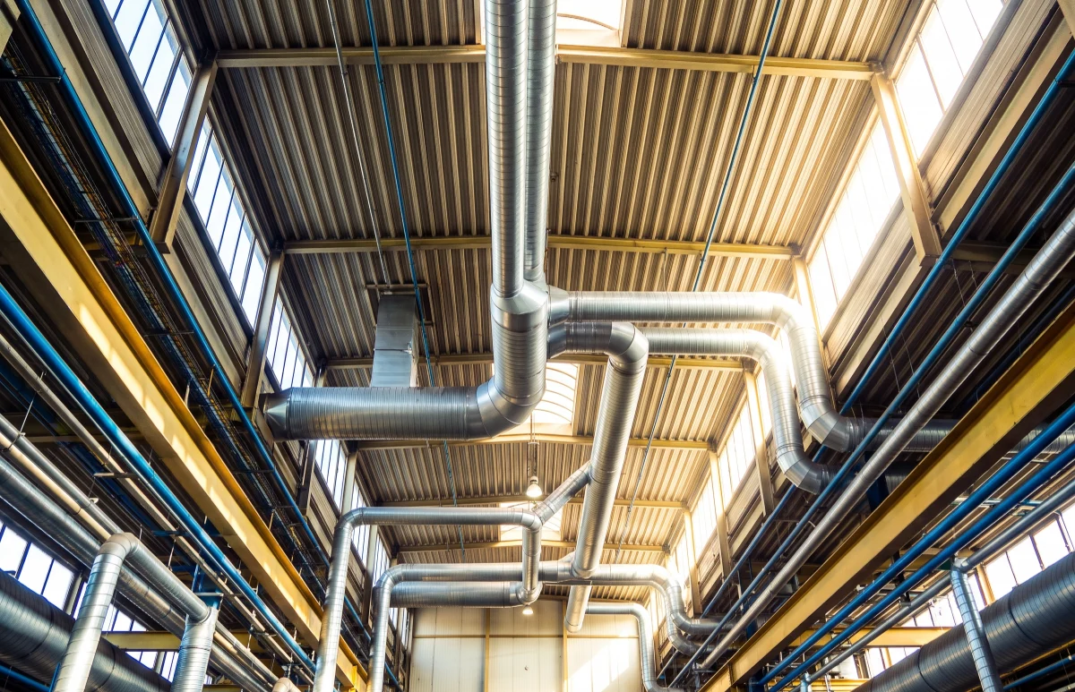 Process pipework running along the ceiling of the mill