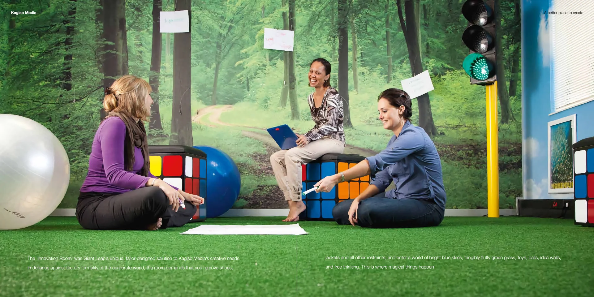 a group of people sitting on top of a green field