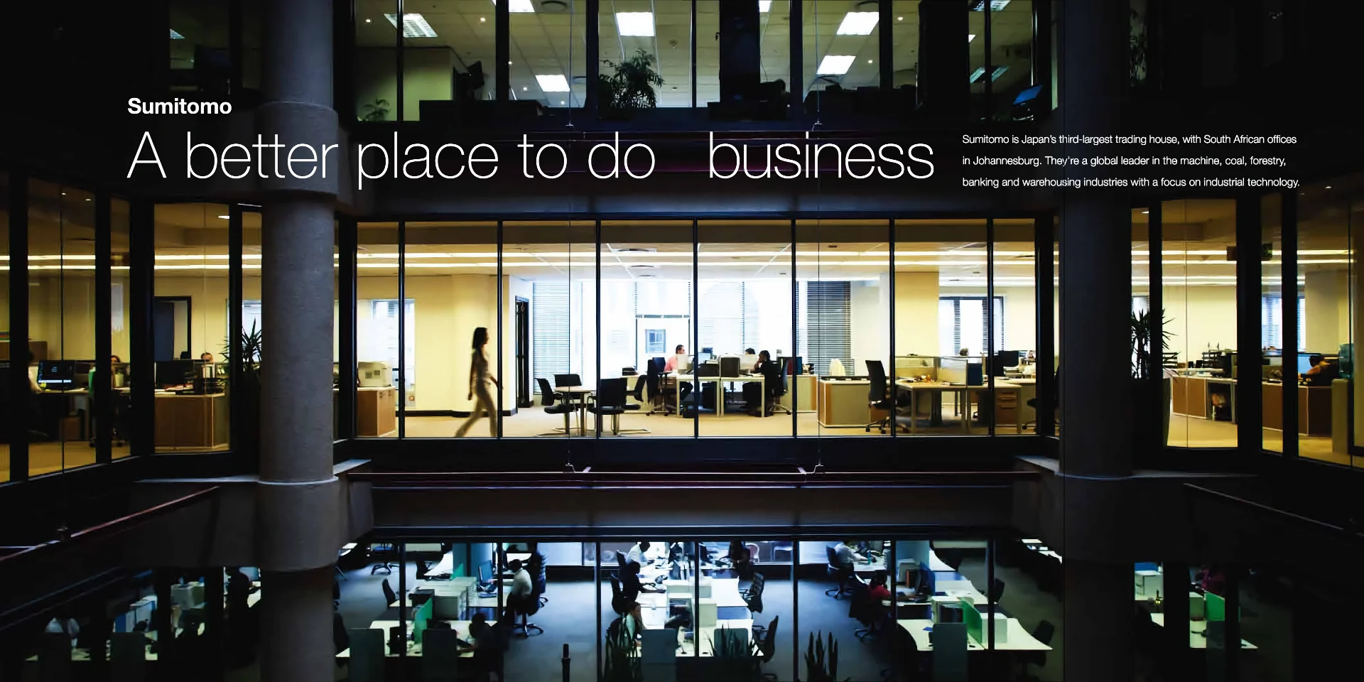 an office building with glass walls and a sign that says a better place to do
