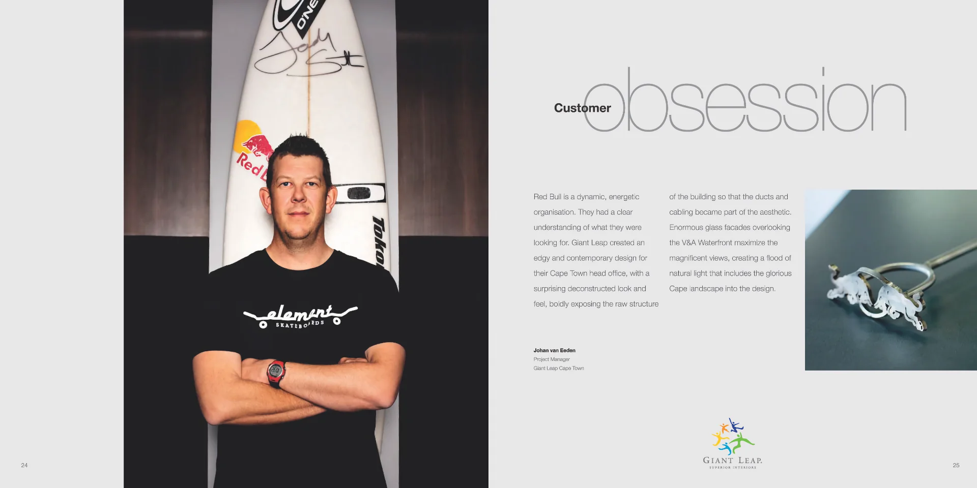 a man standing next to a surfboard with his arms crossed