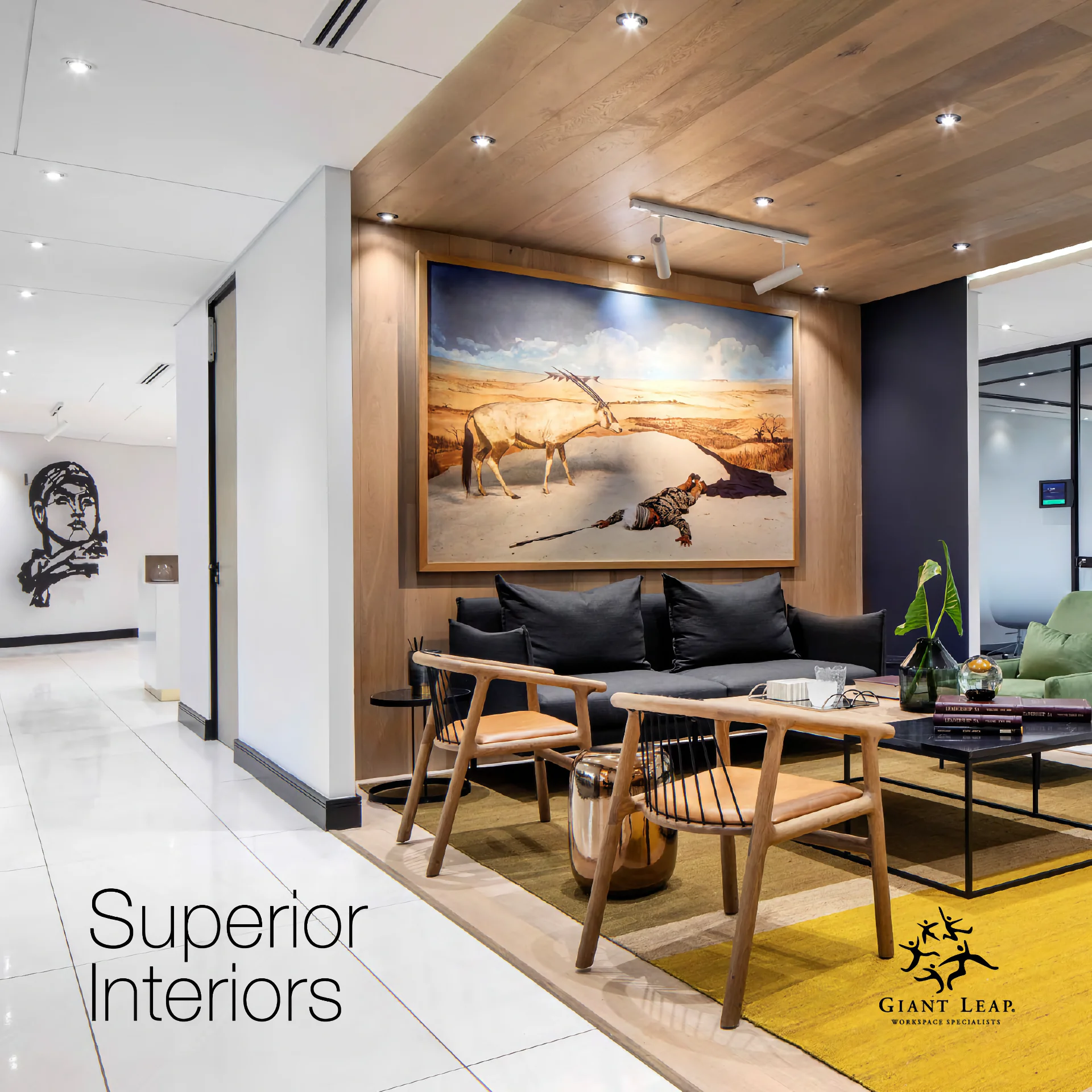 a waiting room filled with furniture and a painting on the wall