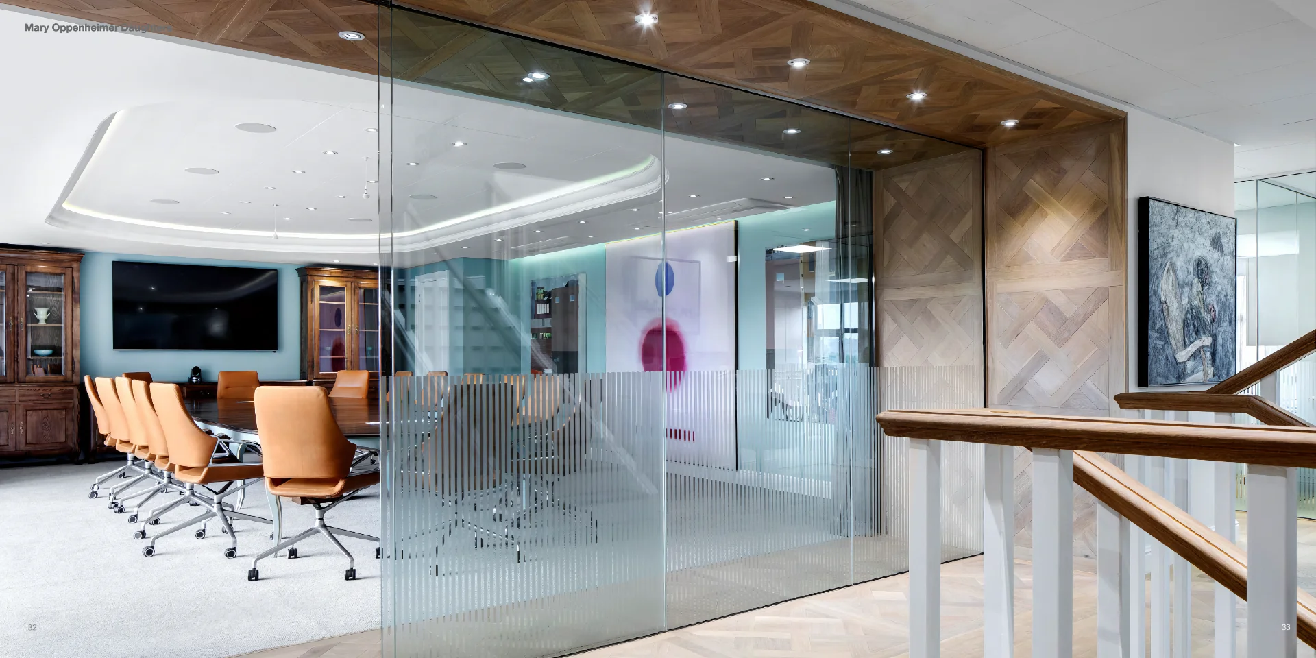 a glass walled conference room with a television on the wall