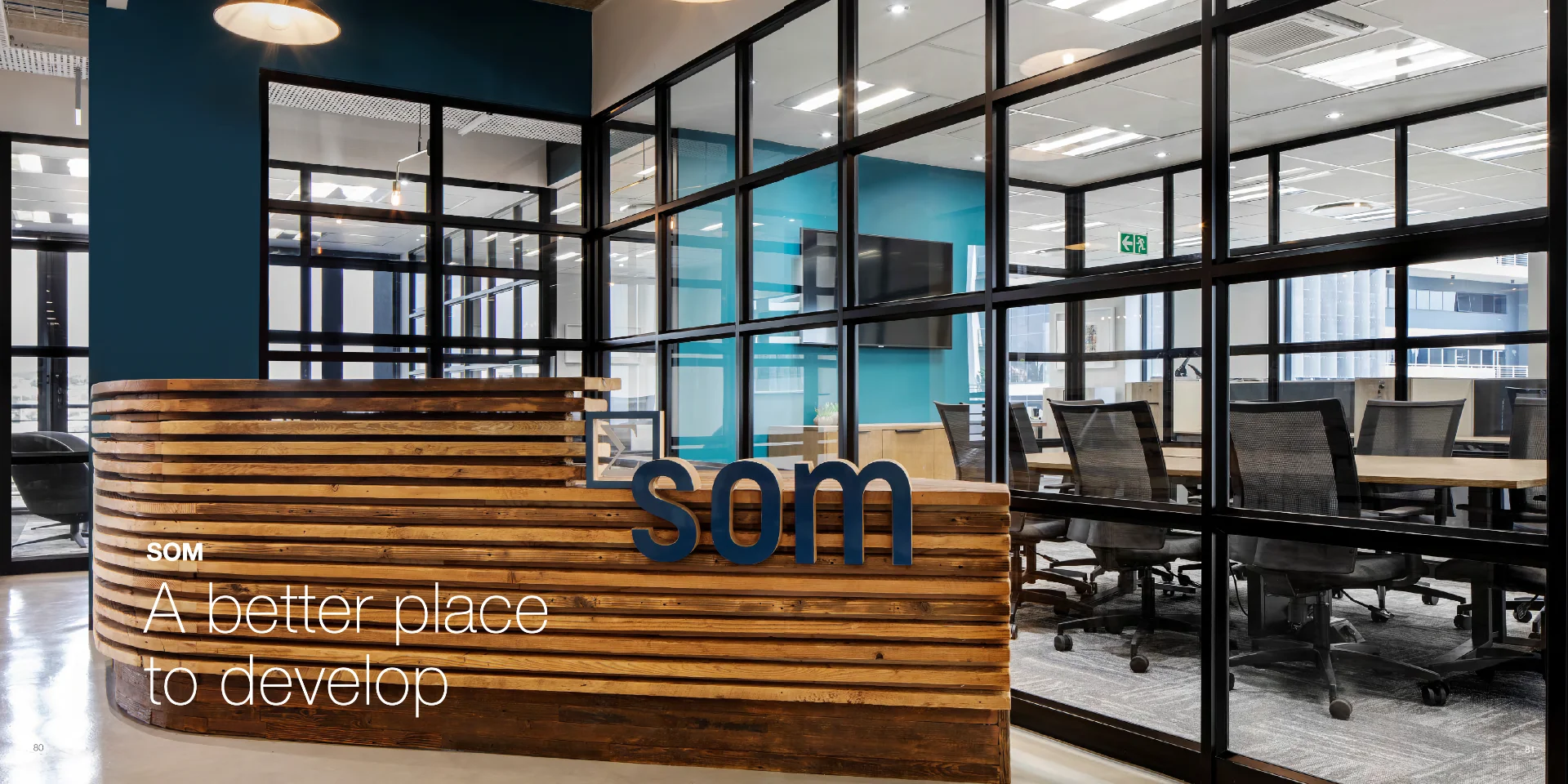 an office with a wooden sign that says som