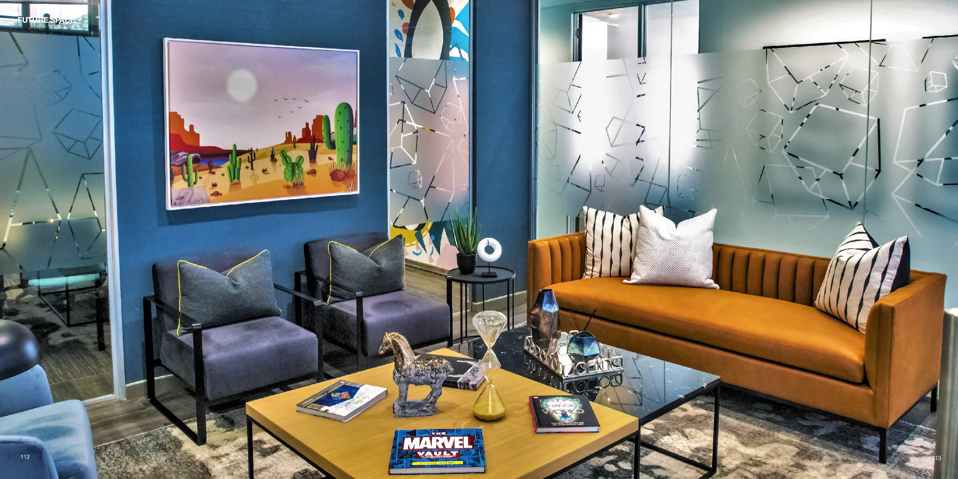 a living room filled with furniture and a painting on the wall