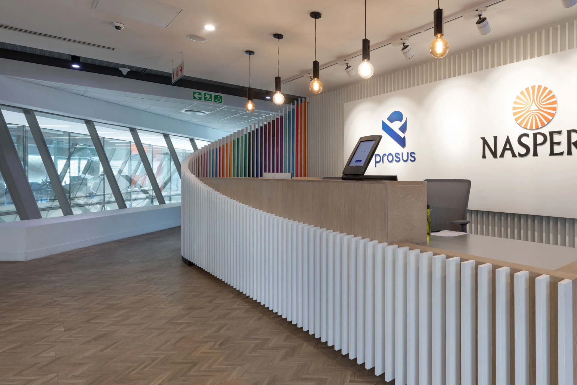 a reception desk with a laptop on top of it