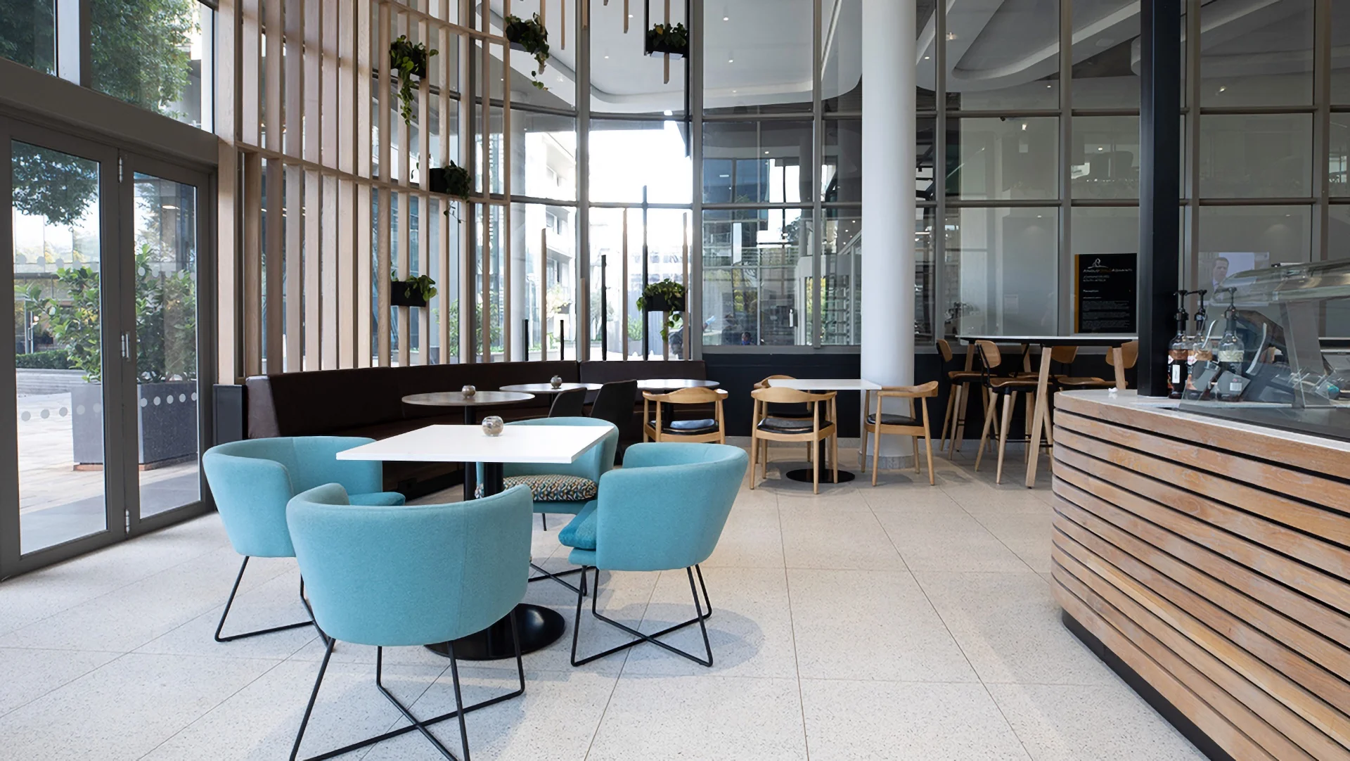 a pause area with tables, chairs, and a counter