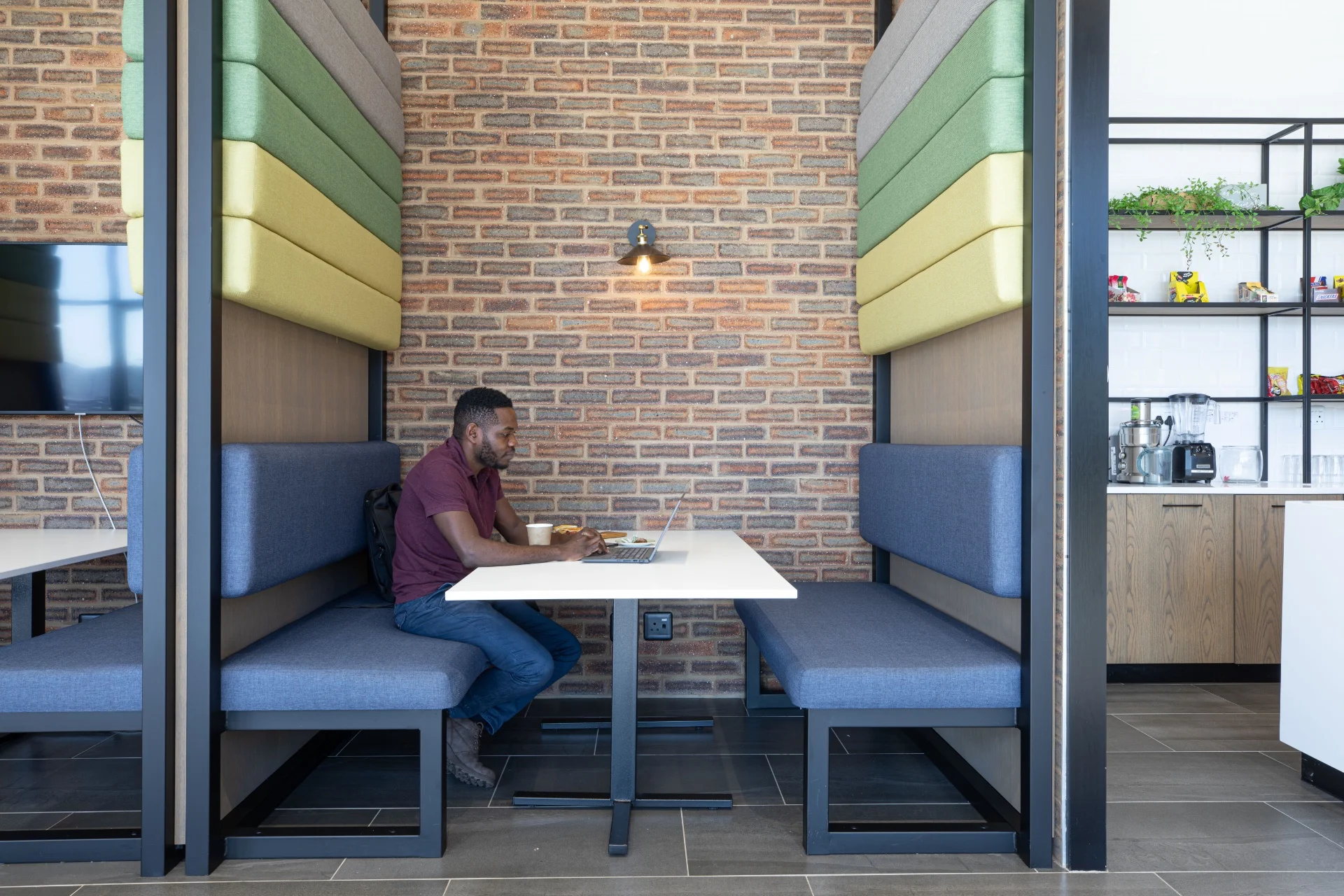 a man sitting at a table in a restaurant