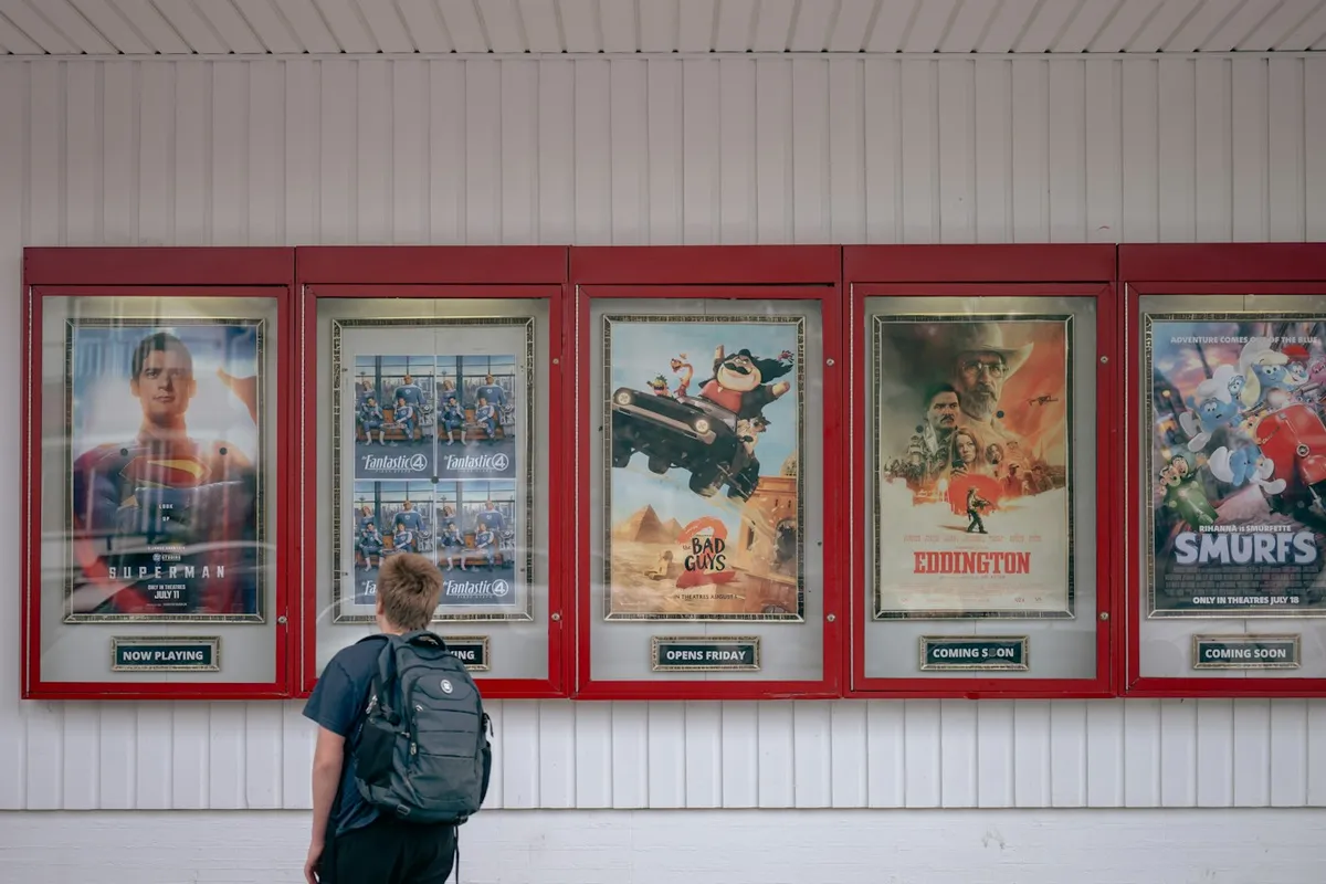 A figure in front of the posters