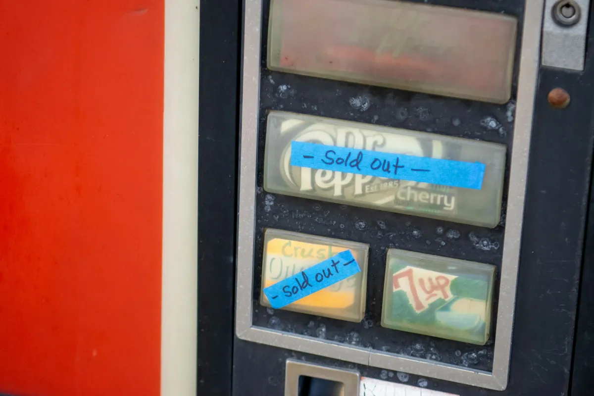 A vending machine with several selections marked sold out in their slots