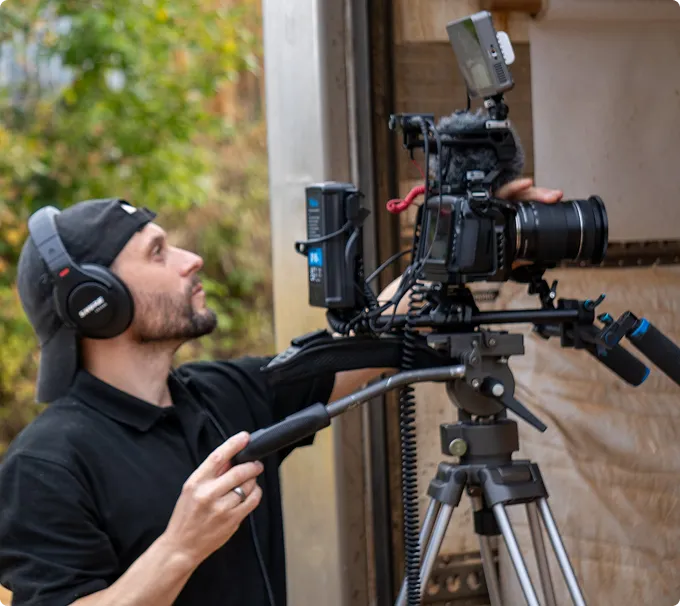 man making video with pro camera