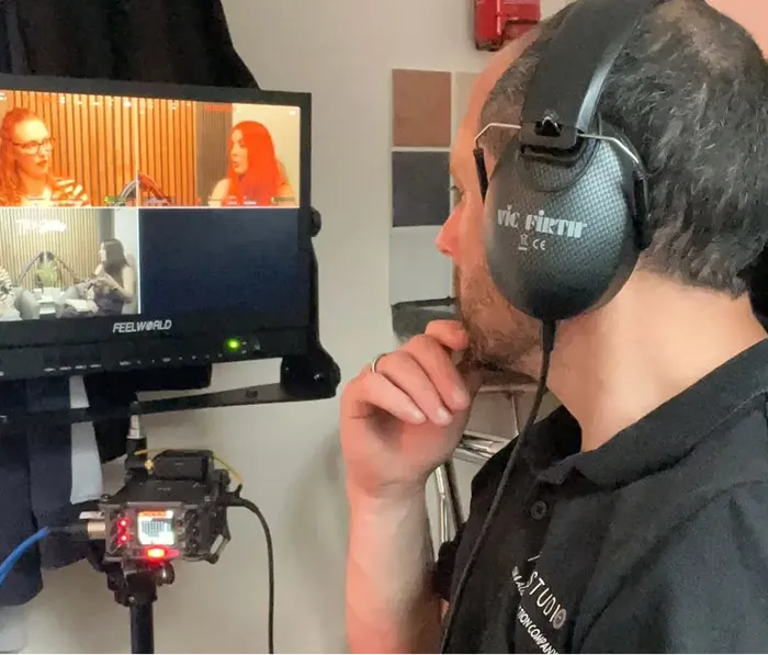 videographer checking video while shooting