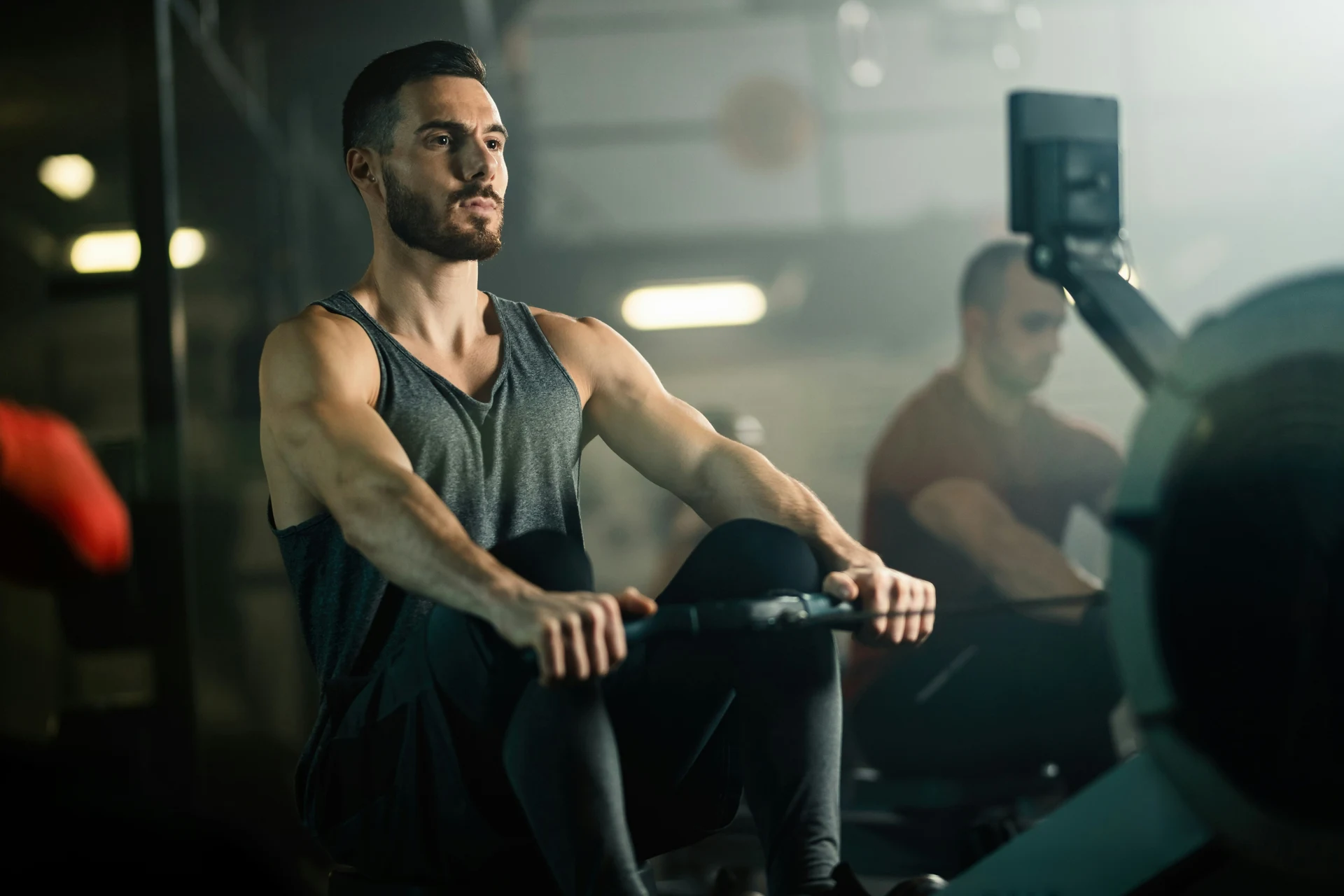 Athlete training while a coach films his movement