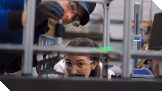 A photo of two people focusing on a task