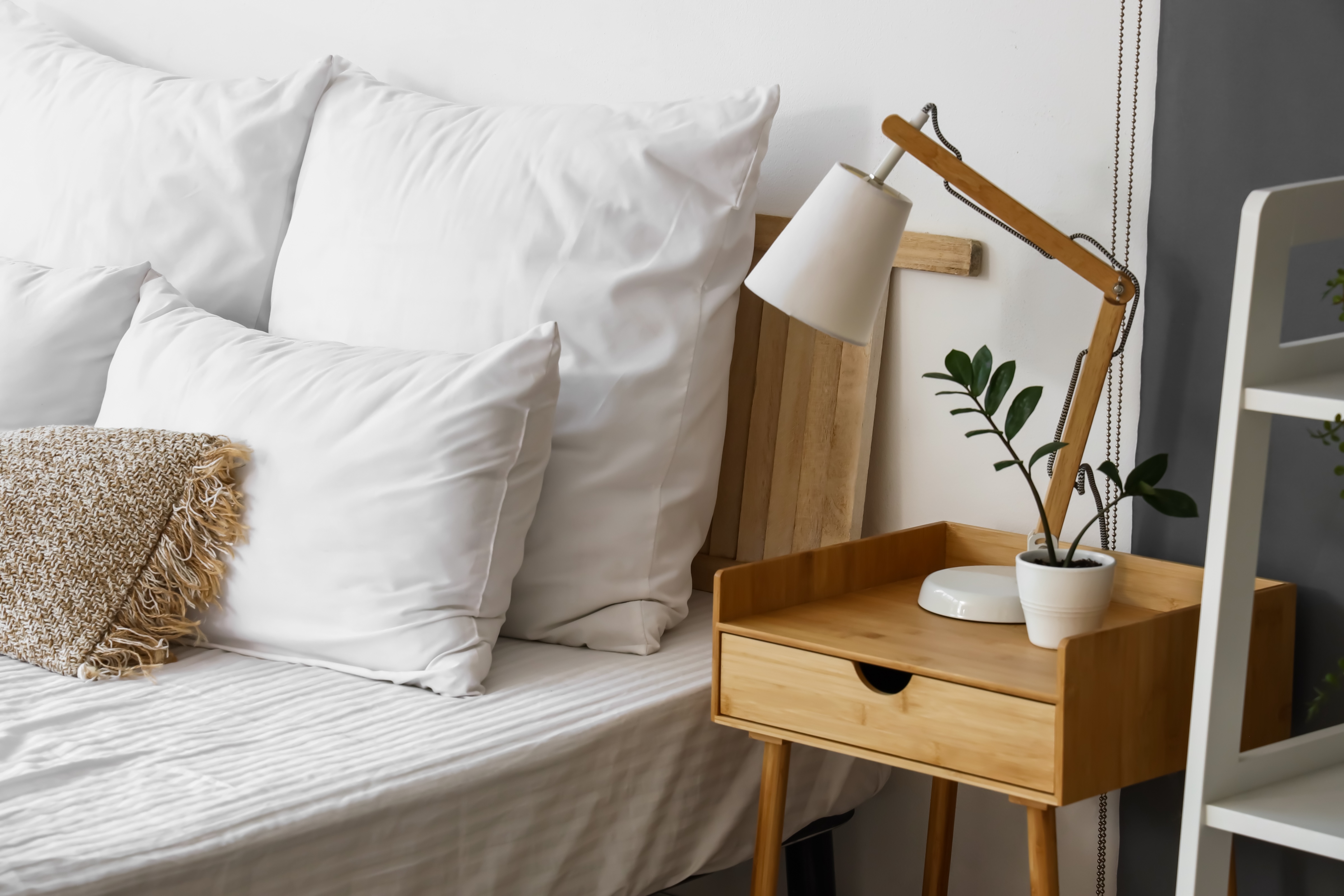 Bed with nightstand stock image