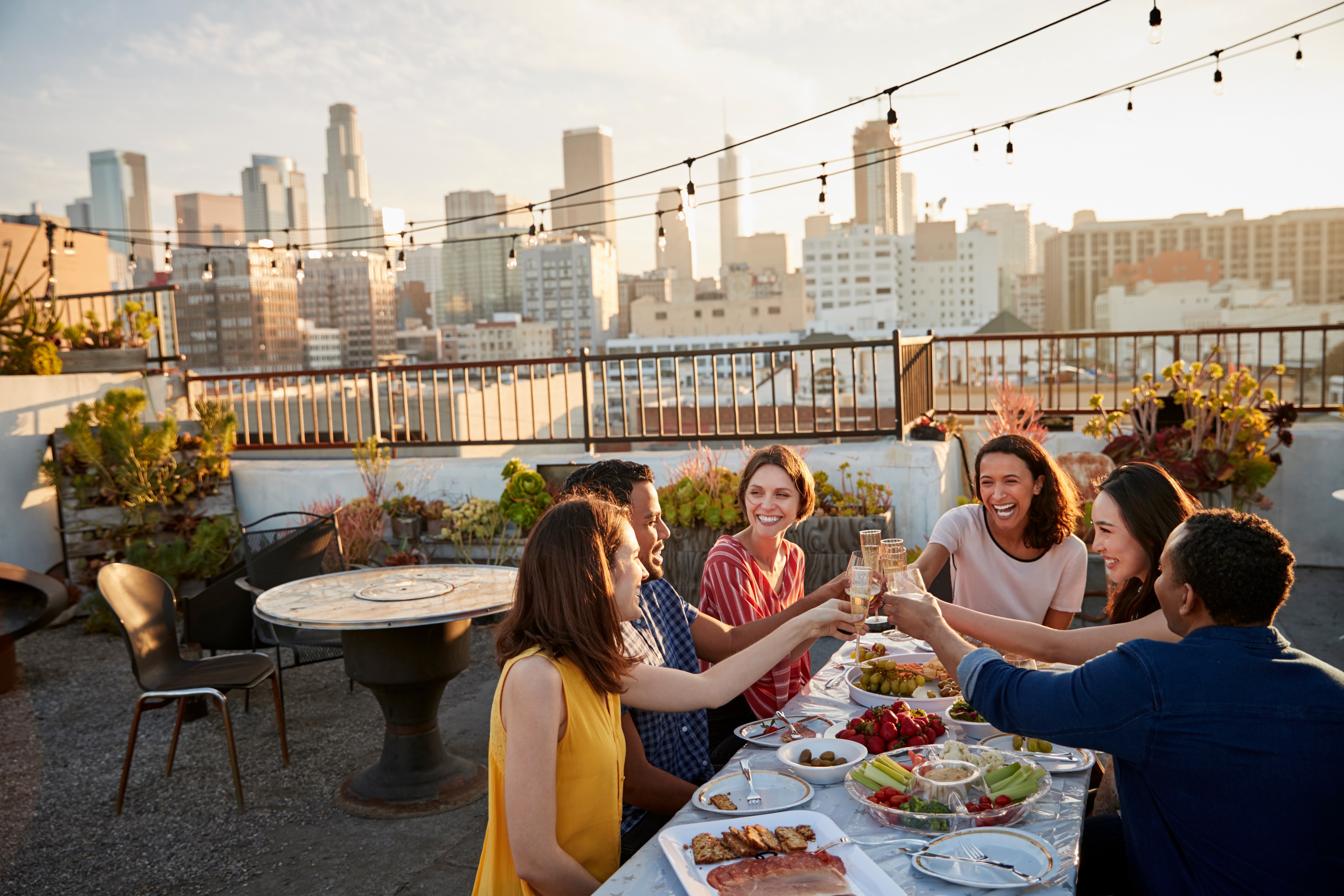People eating on a rooftop stock image