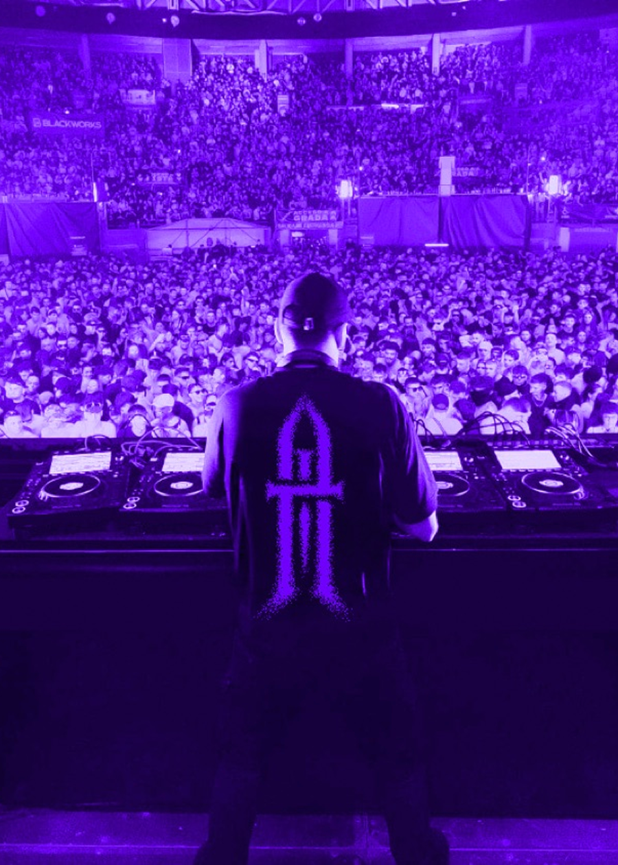 DJ performing at ASSAULT with the crowd in front