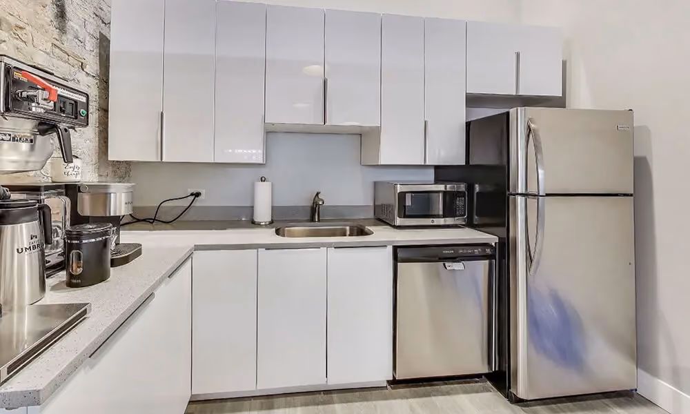 Modern coworking spaces in Chicago, including a kitchenette and free coffee for the shared office space
