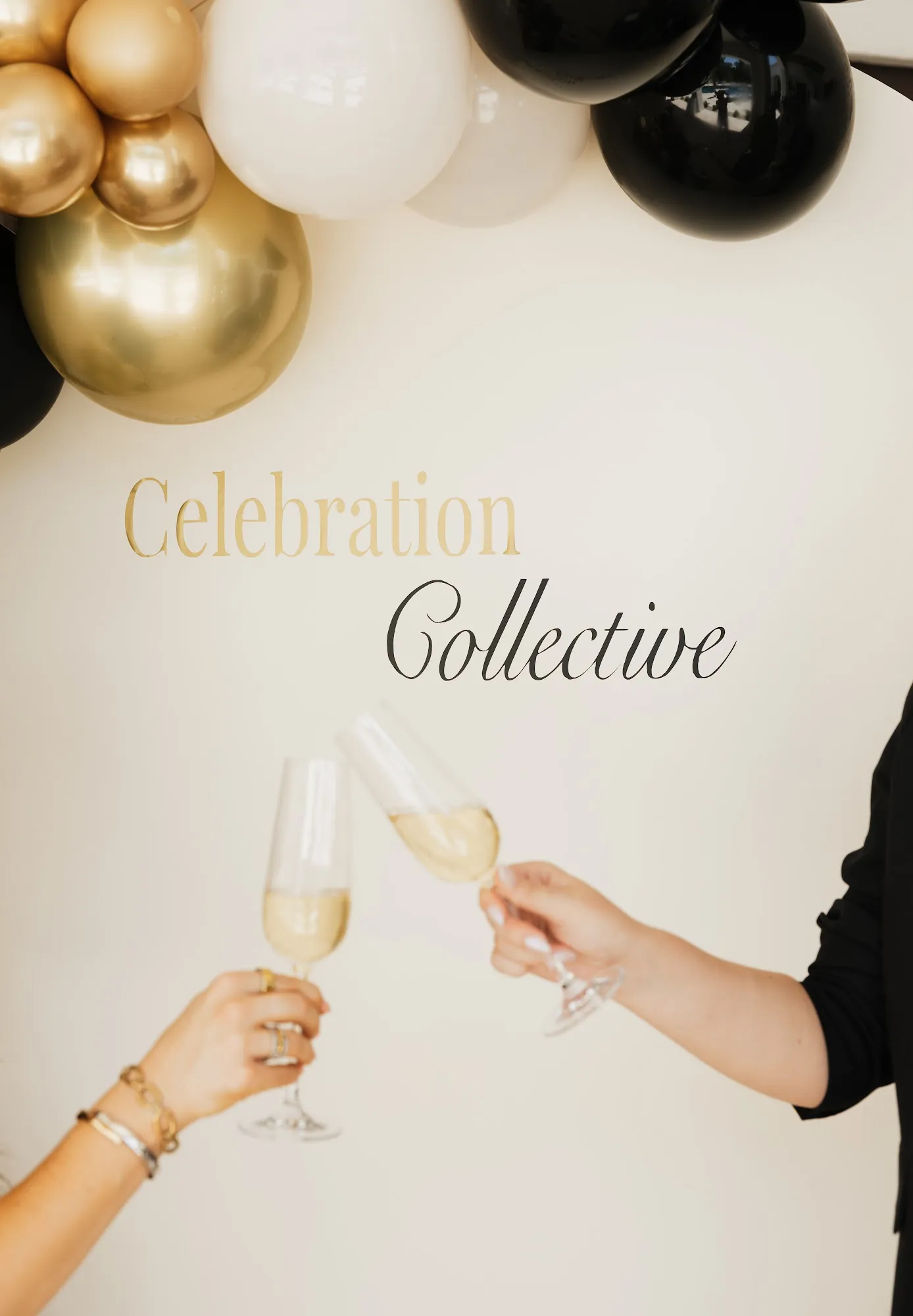 Two champagne glasses raised in front of a Celebration Collective arch