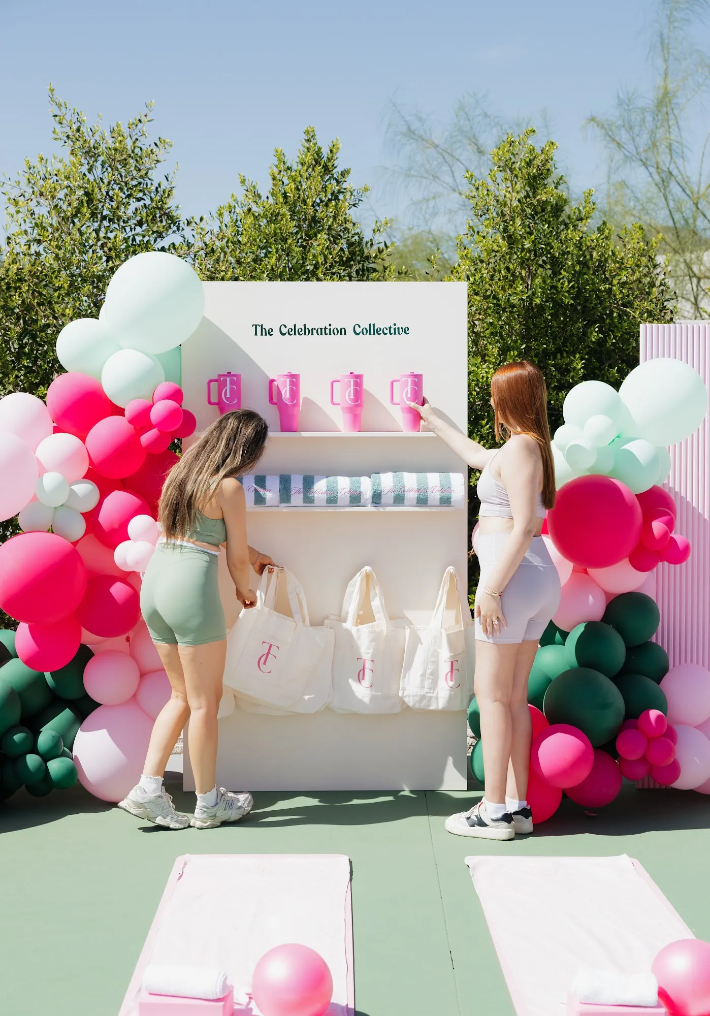 Guests browsing a pink branded display at The Athletic Club