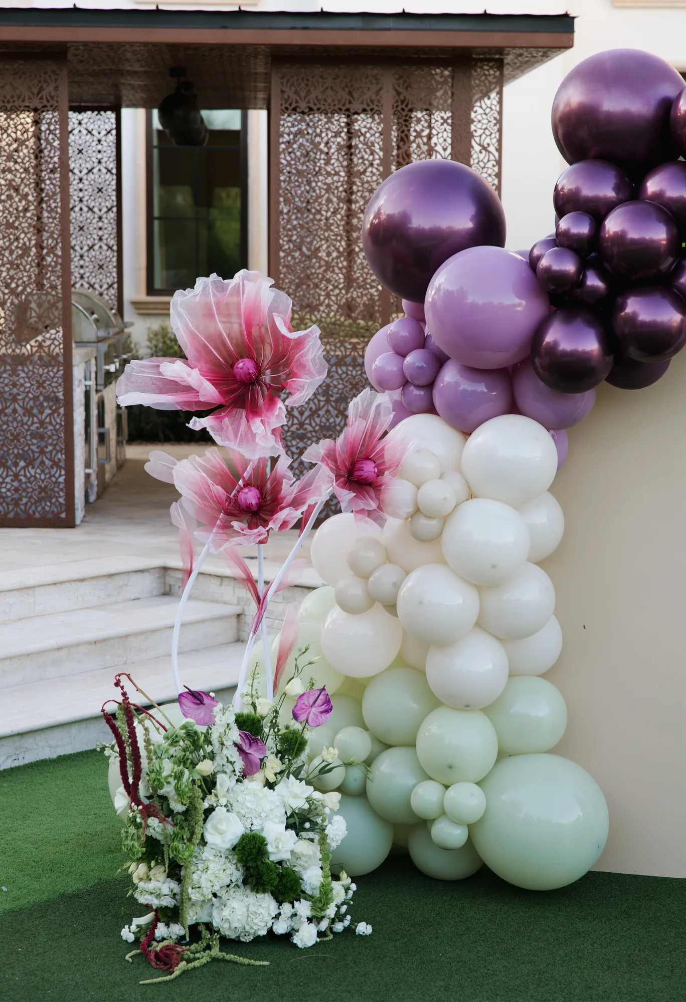 Plum, cream and sage balloon garland with oversized florals