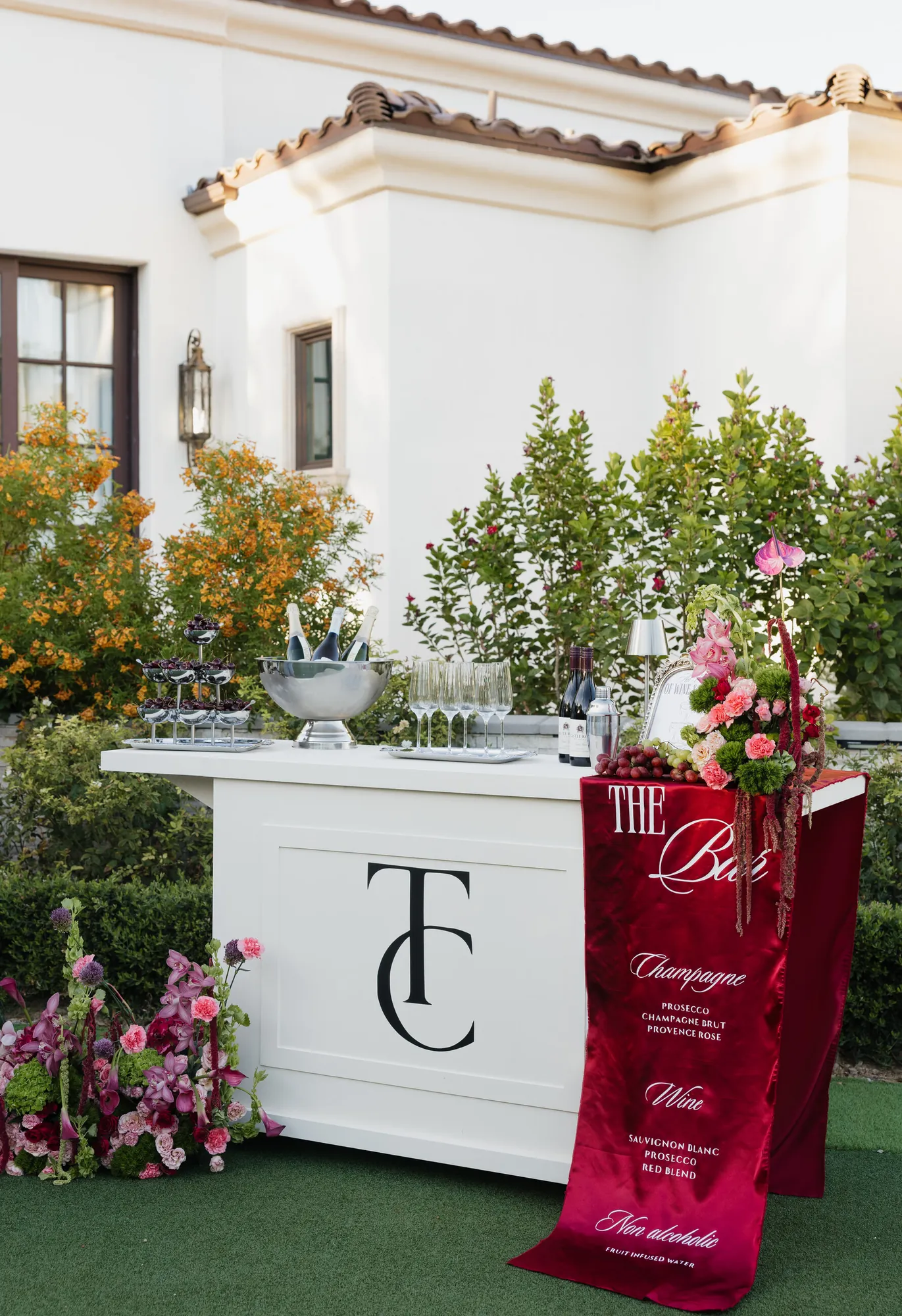 White TC monogram bar cart with a red menu banner