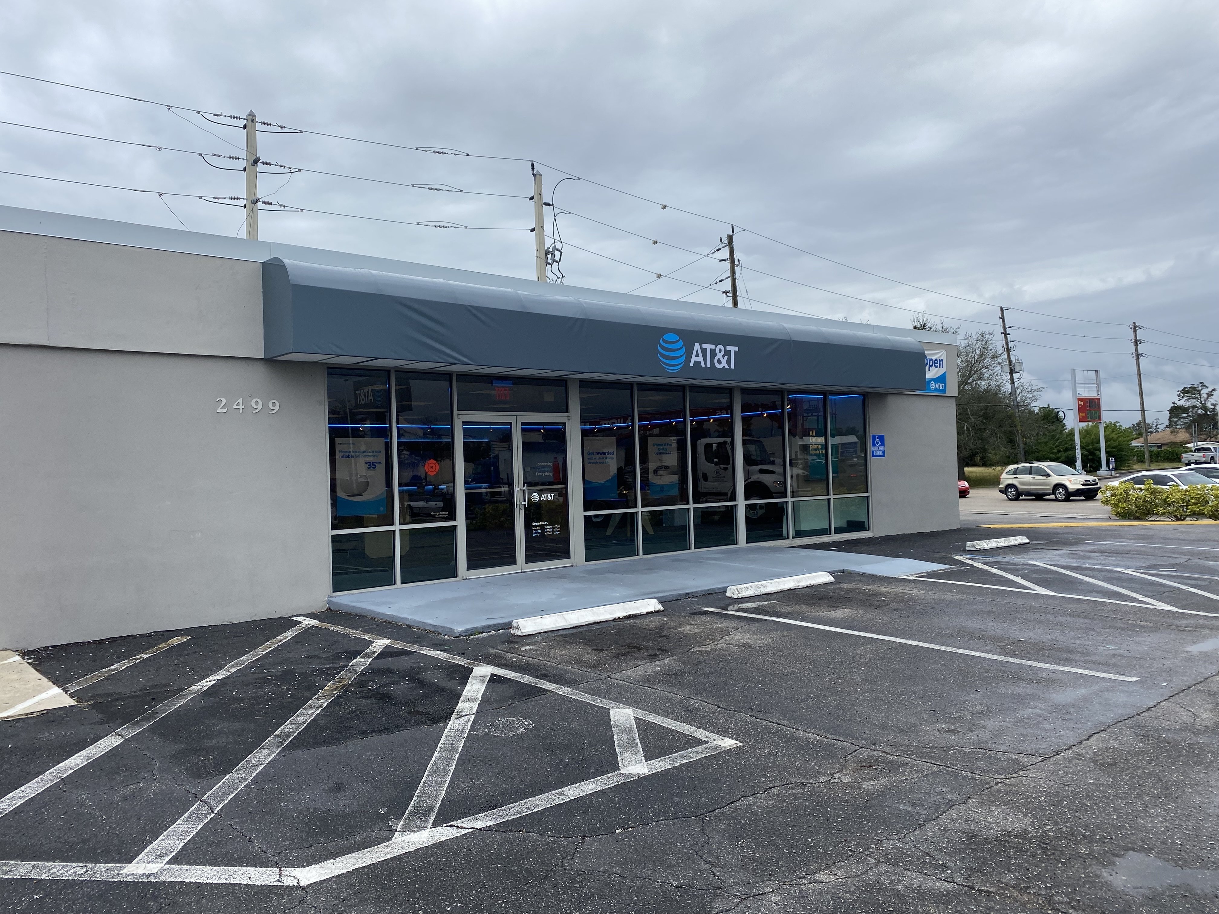 Wide exterior view of completed AT&T retail storefront and awning signage