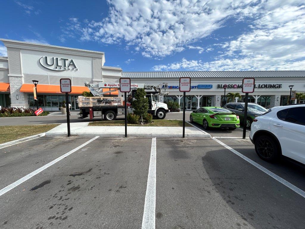 Ulta Beauty storefront channel letters and curbside pickup signs at shopping center