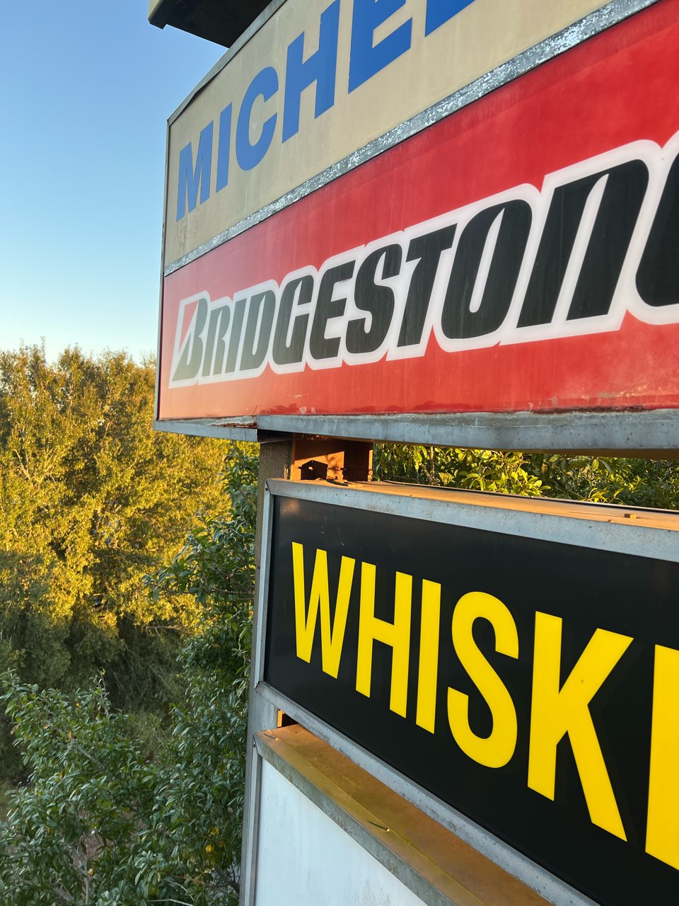 Multi-tenant pylon cabinets showing Bridgestone and Michelin brand panels