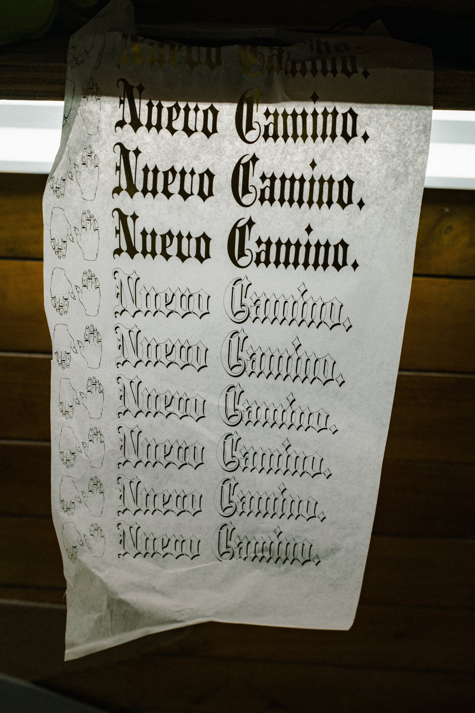 A Nuevo Camino print hanging in the shaping bay