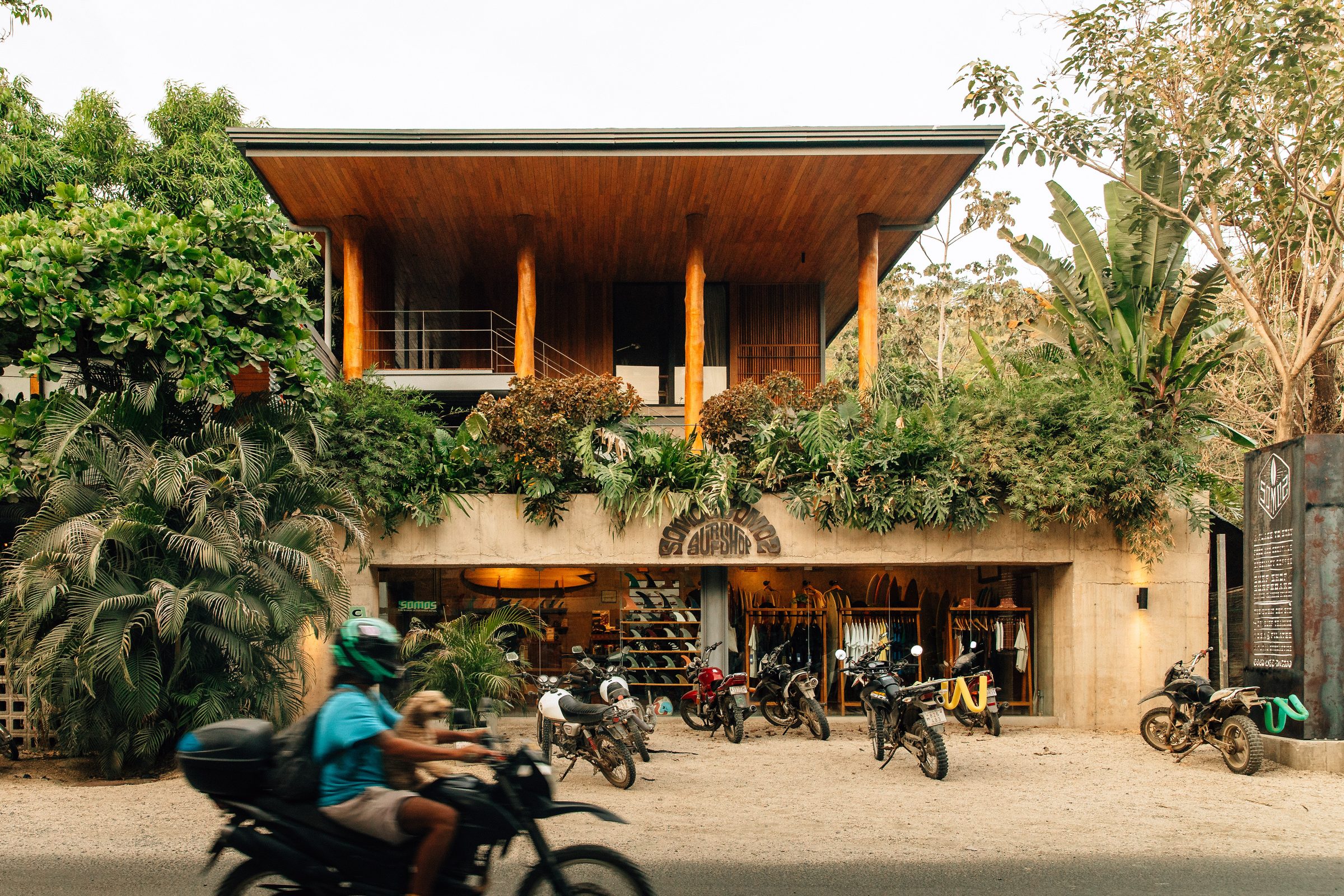 The Somos building exterior with motorbikes parked out front