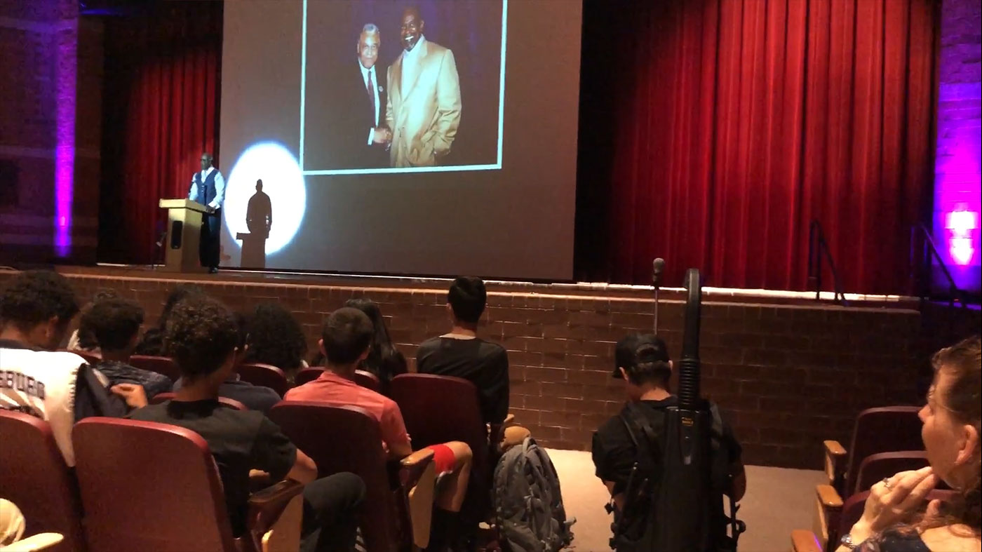School audience watching the speaking tour