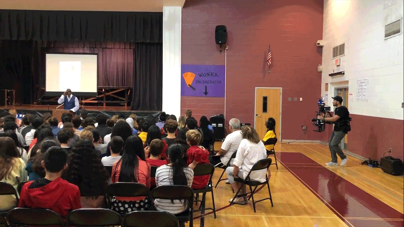 Filming a school speaking event